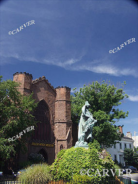 Washington Square Scene
In the foreground the Roger Conant statue is heavy with a patina 
that contrasts with bricks and foliage behind. From Salem, MA.
Keywords: salem; washington square; statue; photograph; picture; print
